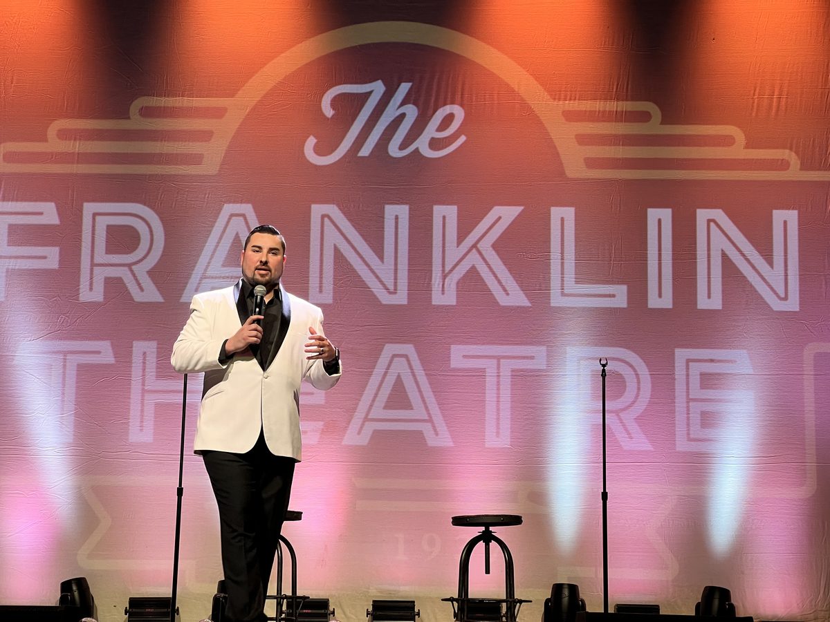 Eric Skeldon speaking on stage at The Franklin Theatre