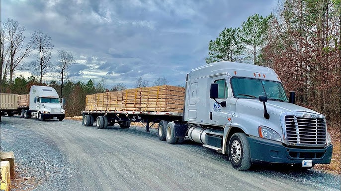 Loaded lumber flatbeds, the freight Eric Skeldon moved as a brokerage owner