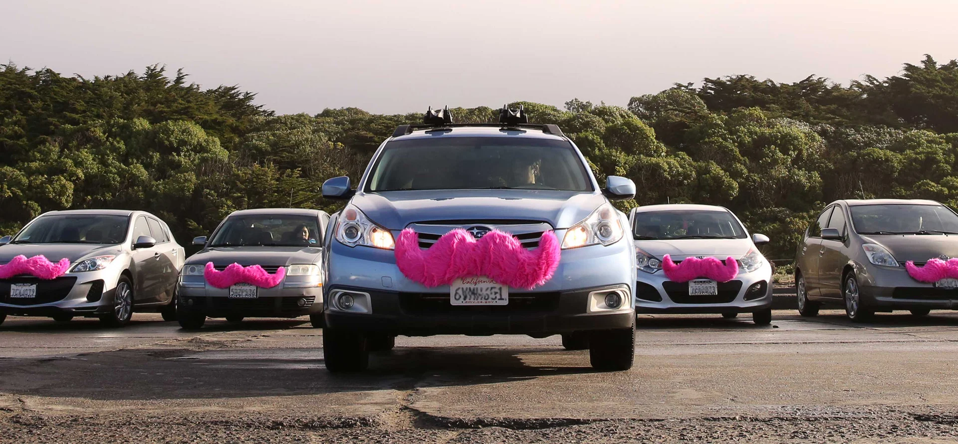 Lyft cars with the signature pink mustache, from Eric Skeldon's time as a top Lyft Ambassador