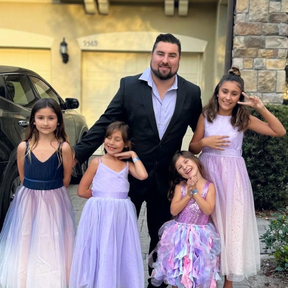 Eric Skeldon with his daughters, his princess warriors