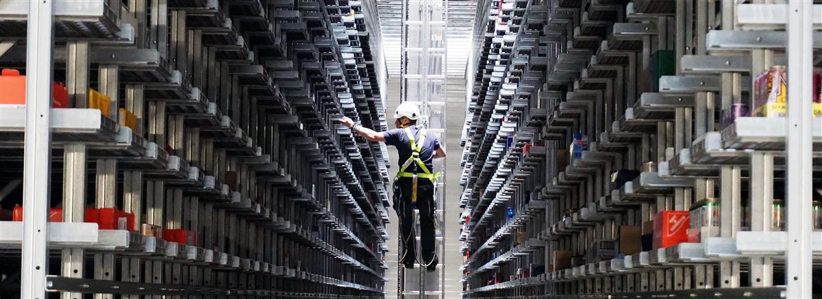 Eric Skeldon as a machine operator inside an 80 percent automated Target distribution center run by Witron in Denton, Texas
